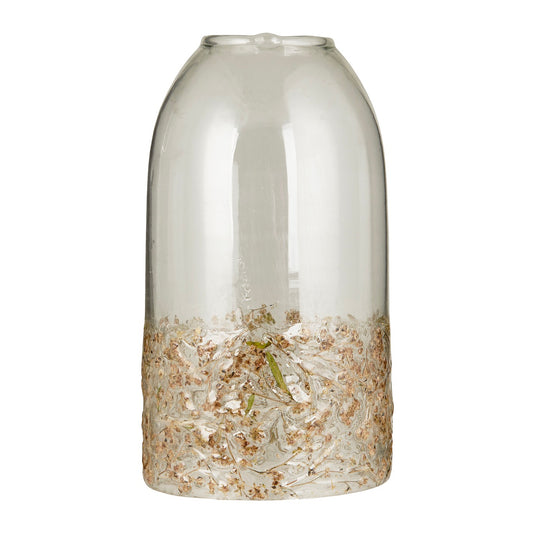 Glasglocke mit Gras im Glas